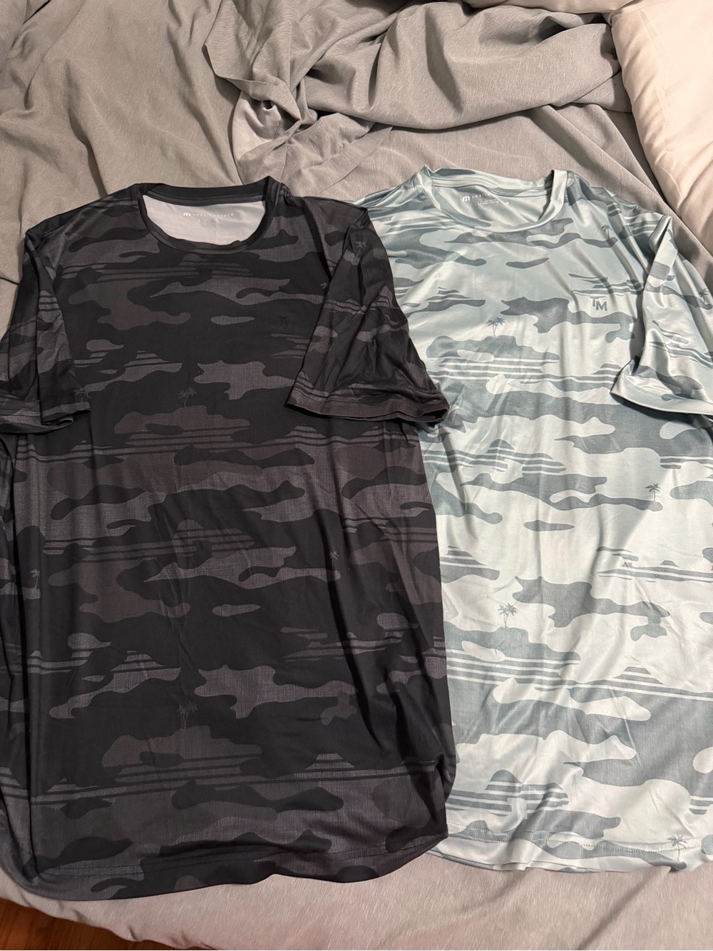 Men's Large pair of Travis Mathew polyester shirts (black and green)